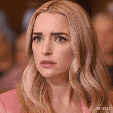 a close up of a woman 's face with the word netflix on the bottom