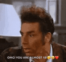 a man in a suit is talking to another man and says `` omg ! you are almost 18 ! ''