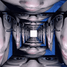 a row of faces with glasses are lined up in a row