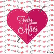 a pink heart with feliz dia das maes written on it and a needle sticking out of it