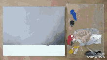 a painting on a canvas next to a palette that says made in animatica on it