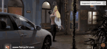 a man is carrying a woman in his arms with an advertisement for sony liv in the corner