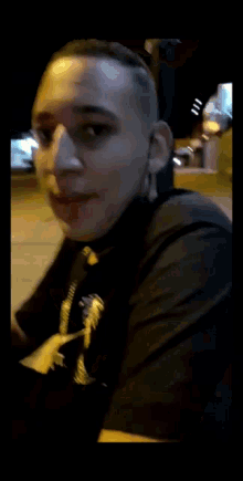 a close up of a man 's face with a blurred image