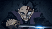 a man with blood on his face is holding a sword
