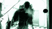 a silhouette of a person standing in a room