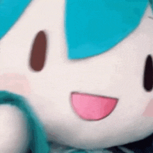 a close up of a stuffed animal with a pink tongue .