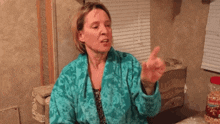 a woman in a bathrobe says " you are a piece of shit " in white letters