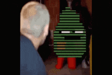a pixelated image of a person with a green striped face