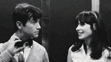 a black and white photo of a man and a woman