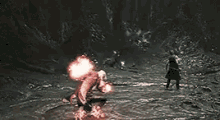 a man is kneeling down with a fireball in his hands