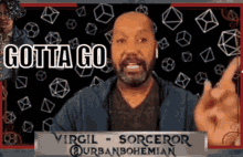 a man with a sign that says virgil sorcerer on it