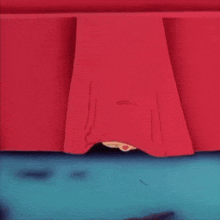 a cartoon character is peeking out from under a red curtain
