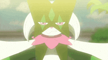 a green and white cartoon character with a pink scarf around its neck
