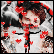 a man in a mask is surrounded by red hearts and has a spider web behind him