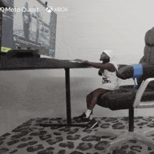 a child sits in a chair in front of a computer screen that says meta quest