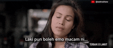 a woman with her eyes closed and a caption that says laki pun boleh emo macam ni