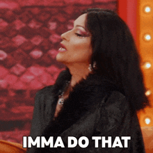 a woman says " imma do that " while wearing a black fur coat