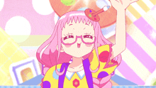 a girl with pink hair and glasses is holding a paint brush