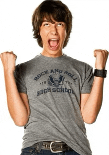 a young man wearing a rock and roll high school t-shirt