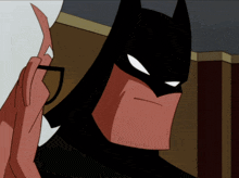 a cartoon of batman wearing glasses and a mask