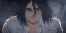 a close up of eren from attack on titan looking at the camera .