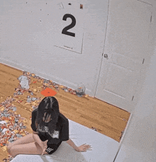 a person dressed as a bottle of hot sauce is standing in a doorway
