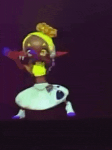 a cartoon character wearing a yellow hat and a white dress is dancing .