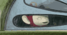 a teletubbies character is looking out of a tent