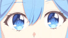 a close up of a girl 's blue eyes with a circle in the middle