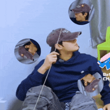 a man wearing a hat that says ny on it is holding a rope
