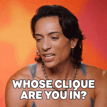 a woman says whose clique are you in while wearing a necklace