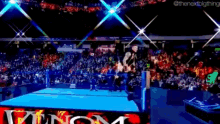 a wrestling ring with a banner that says venom on it