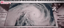 a newspaper with a picture of a hurricane and the headline " launches weather satellite insat "