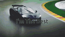 a black sports car is driving on a wet track and says i 'm the best on the bottom