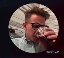 a man drinking from a glass with the time of 14:25 on the bottom
