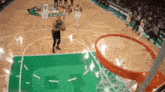 a basketball game is being played on a court with the letter p on the floor