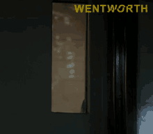 a dark room with the word wentworth on the bottom