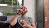 a man with a tattoo on his arm eating food