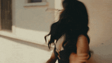 a woman 's hair is being blown by the wind
