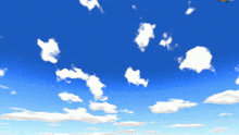a blue sky with white clouds and a yellow plane in the background