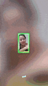 a picture of a woman is surrounded by a green border and the word izumi is visible