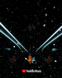 a man singing into a microphone with the youtube music logo in the background