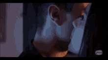 a close up of a man 's face with a playz logo on the bottom