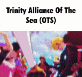 trinity alliance of the sea ( ots ) is written above a blurry picture of people