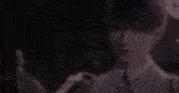 a close up of a person 's face with a blurred background .