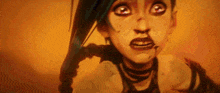 a close up of a cartoon character 's face with a sword in her hand .