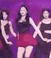 a group of women are dancing in front of a blue background that says ' x '