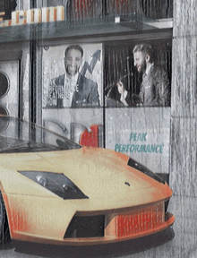 a car is parked in front of a building with a sign that says peak performance