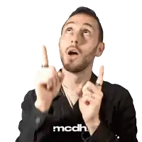 a man wearing a black shirt that says mcdh