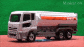 a toy truck with eneos written on the side